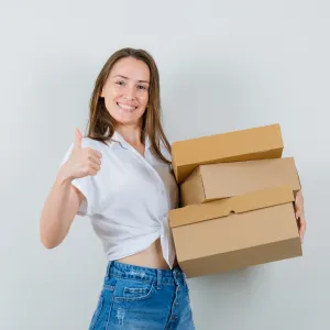 A happy girl holding packages